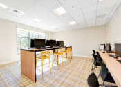 Thumbnail 20 of 21 - business center with computer stations and large windows at archer park apartments in southeast Washington dc
