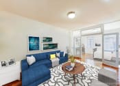 Thumbnail 3 of 20 - living area with sofa, coffee table, hardwood floors and view of bedroom at baystate apartments in washington dc