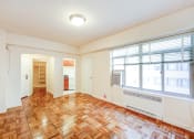 Thumbnail 8 of 20 - vacant living area with hardwood flooring and large windows at baystate apartments in washington dc