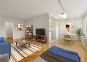 Thumbnail 9 of 37 - A living room with a blue couch, a wooden coffee table, a television, a refrigerator, and a potted plant.