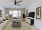 Thumbnail 5 of 25 - living area with sofa, coffee table, large windows, and ceiling fan at the calverton apartment building in washington dc