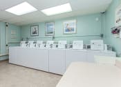Thumbnail 22 of 25 - the calverton apartments laundry room