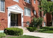 Thumbnail 20 of 23 - exterior of brick apartment building at cambridge square apartments in bethesda md