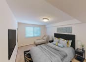 Thumbnail 10 of 23 - bedroom with bed, nightstands, large windows and tv at cambridge square apartments in bethesda md