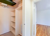 Thumbnail 11 of 23 - large bedroom closet with shelving  at cambridge square apartments in bethesda md