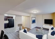 Thumbnail 3 of 7 - living area with sofa, coffee table, large patio doors, tv, credenza and view of kitchen at city towns apartments in washington dc
