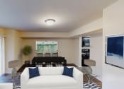 Thumbnail 2 of 7 - living area with sofa, coffee table, large patio doors and view of dining area at city towns apartments in washington dc