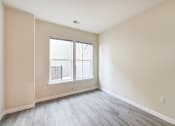 Thumbnail 16 of 18 - vacant bedroom with hardwood flooring and large windows at city view apartments in washington dc
