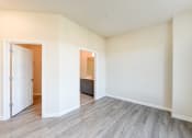 Thumbnail 17 of 18 - vacant bedroom with hardwood floors and view of bathroom at city view apartments in washington dc