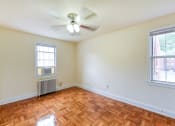 Thumbnail 11 of 21 - vacant bedroom with hardwood flooring and ceiling fan at colonnade apartments in washington dc