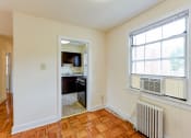 Thumbnail 6 of 21 - Dining area with view of kitchen with window and energy efficient appliances at colonnade apartments in washington dc