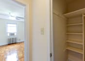 Thumbnail 20 of 21 - large closet with shelving and view of hallway at  colonnade apartments in washington dc