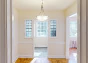 Thumbnail 7 of 18 - view through hallway to kitchen and living area at 4031 davis in glover park washington dc