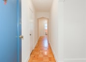Thumbnail 8 of 17 - apartments unit hallway with hardwood floors at 1400 van buren apartments in washington dc