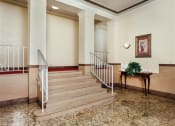 Thumbnail 10 of 12 - lobby lounge with stairs to apartment homes at 2801 Pennsylvania apartments in washington dc