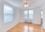 Thumbnail 12 of 21 - vacant bedroom with hardwood flooring and ceiling fan at 6100 14th Street apartments in washington dc