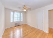 Thumbnail 13 of 21 - vacant bedroom with hardwood flooring and ceiling fan at 6100 14th Street apartments in washington dc