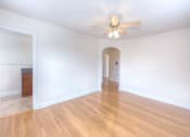 Thumbnail 6 of 21 - vacant living area with hardwood flooring and ceiling fan at 6100 14th Street apartments in washington dc