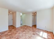 Thumbnail 11 of 16 - vacant living area with hardwood floors and view of entrance at alpha house apartments in washington dc