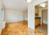 Thumbnail 2 of 24 - vacant dining area with view of living area with hardwood floors and large windows at chillum place apartments in lamond riggs washington dc