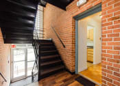 Thumbnail 20 of 24 - stairwell and exposed brick walls at chillum place apartments in lamond riggs washington dc