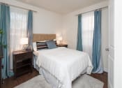 Thumbnail 9 of 25 - bedroom with bed, nightstands and large windows at fairway park apartments in washington dc