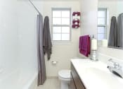 Thumbnail 14 of 25 - bathroom with tub, vanity, toilet and window at fairway park apartments in washington dc