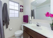 Thumbnail 15 of 25 - bathroom with tub, vanity, toilet and window at fairway park apartments in washington dc