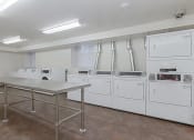 Thumbnail 16 of 21 - laundry room at juniper courts apartments in takoma washington dc