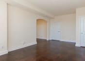 Thumbnail 13 of 21 - vacant living area with hardwood flooring, coat closets and view of front entrance at juniper courts apartments in takoma washington dc
