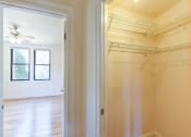 Thumbnail 8 of 28 - large closet with view of living area at the klingle apartments in washignton dc