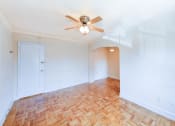 Thumbnail 14 of 33 - vacant bedroom with hardwood floors, closet and ceiling fan at the meridian park apartments in columbia heights washington dc