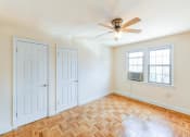 Thumbnail 17 of 33 - vacant bedroom with hardwood floors, large closets and windows at the meridian park apartments in columbia heights washington dc