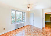 Thumbnail 8 of 17 - vacant bedroom with hardwood floors, closet and ceiling fan at randle circle apartments in washington dc