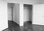 Thumbnail 6 of 6 - vacant bedroom with large closets and hardwood flooring at sheridan station apartments in washington dc