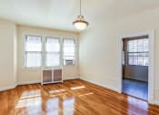 Thumbnail 23 of 29 - vacant dining toom with large windows and hardwood floors at the frontenac apartments in van ness washington dc