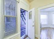 Thumbnail 17 of 35 - hallway with view of living area and balcony at dupont apartments in washington dc
