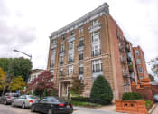 Thumbnail 31 of 35 - exterior of brick apartment building at dupont apartments in washington dc