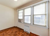 Thumbnail 12 of 20 - vacant bedroom with hardwood flooring, lighting and large windows at eddystone apartments in washington dc