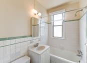 Thumbnail 14 of 20 - bathroom with toilet, vanity, tub, and window at eddystone apartments in washington dc