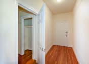 Thumbnail 24 of 29 - hallway view of front entrance with hardwood floors at the frontenac apartments in van ness washington dc
