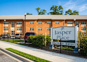 Thumbnail 18 of 18 - A building with a sign that says "Jasper Place" in front of it.
