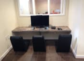 Thumbnail 19 of 25 - resident gaming station with monitor, game controllers, and fun chairs at fairway park apartments in washington dc
