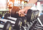 Thumbnail 10 of 11 - A person is lifting a dumbbell in a fitness center.