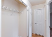 Thumbnail 13 of 19 - hallway with hardwood flooring and large closet at fort totten apartments in washington dc