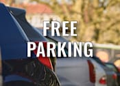 Thumbnail 16 of 18 - A line of cars parked in a parking lot with the words "FREE PARKING" superimposed on the image.
