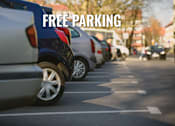 Thumbnail 43 of 43 - A line of cars parked in a parking lot with the words "FREE PARKING" overlaid on the image.
