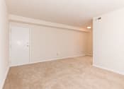 Thumbnail 3 of 16 - living area with carpeting at grandview village apartments in shipley terrace washington dc