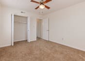 Thumbnail 6 of 16 - bedroom with carpeting and ceiling fan at grandview village apartments in shipley terrace washington dc