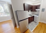 Thumbnail 3 of 25 - Studio A kitchen and entry way at Hampton courts apartments in washington dc